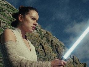 This image released by Lucasfilm shows Daisy Ridley as Rey in "Star Wars: The Last Jedi," in theaters on Dec. 15. (Lucasfilm via AP)
