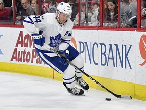 Morgan Rielly of the Toronto Maple Leafs moves the puck against the Carolina Hurricanes on Nov. 24, 2017