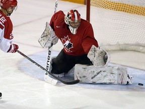 Canadian goalie Michael Dipietro makes a save against Denmark's Magnus Molge on Dec. 15, 2017