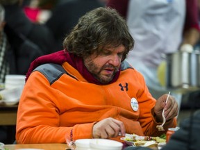 Mark (last name withheld), enjoying a Christmas meal at the Scott Mission in Toronto, Ont. on Monday December 25, 2017.