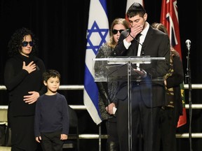 Jonathan Sherman cries as he speaks during a memorial service for his parents Barry and Honey Sherman, as family members look on, in Mississauga, Ontario on Thursday, December 21, 2017. Seventy-five-year-old Barry Sherman and his 70-year-old wife Honey were found dead in their Toronto home last week.