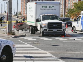 Police investigate the scene after a construction worker was hit and killed at the corner of Eglinton and Midland on Wednesday October 12, 2016.