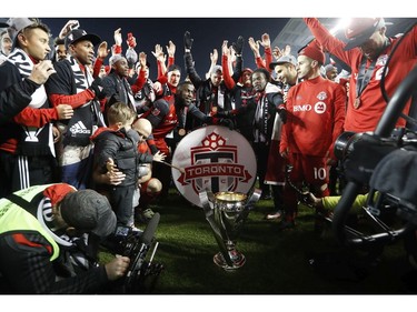 Toronto FC forward Jozy Altidore (17) beats the drum as the Toronto FC celebrate with the crowd following their win over the Seattle Sounders in the MLS Cup Final in Toronto on Saturday, December 9, 2017.