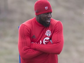 Toronto FC striker Jozy Altidore tries to keep warm during team practice in Toronto on Thursday Dec. 7, 2017. (THE CANADIAN PRESS/Frank Gunn )