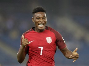 The United States' Ayo Akinola celebrates a goal against Ghana during the FIFA U-17 World Cup match in New Delhi, India, Monday, Oct. 9, 2017. Toronto FC has signed highly touted teenage forward Ayo Akinola, a U.S. under-17 international, as a homegrown player. THE CANADIAN PRESS/AP-Tsering Topgyal ORG XMIT: CPT117
