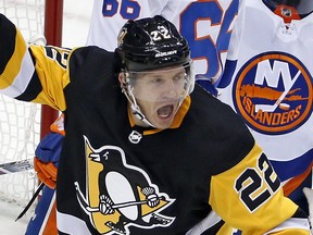 Former Maple Leafs defenceman Matt Hunwick celebrates after scoring in overtime to give Pittsburgh, his current team, a win over the New York Islanders on Dec. 7, 2017. (GENE J. PUSKAR/AP)