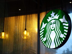 This file photo taken on August 1, 2015 shows a sign for Starbucks is seen in Washington, DC. (KAREN BLEIER/AFP/Getty Images)