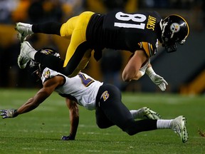 Jesse James of the Pittsburgh Steelers goes airborne after being hit by Marlon Humphrey of the Baltimore Ravens on Dec. 10, 2017