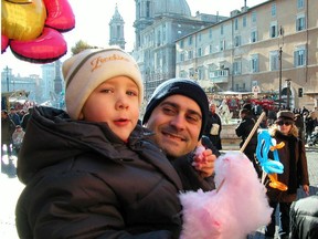 Families enjoy Piazza Navona's Christmas market.