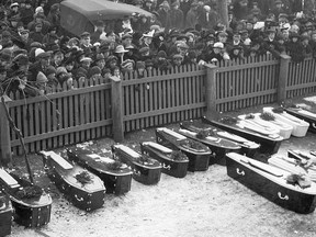 Shocked citizens gathered at one of the city’s schools as preparations were being made for the mass burial of some of the unidentified victims, many of them children. 
Many others were never found. It has been estimated that a total of 1,951 people died as a result of the explosion. This photo was taken Dec. 17, 1917 by prolific Toronto newspaper photographer William James (1866 – 1948). This, and many of his other photos, have been deposited in the City of Toronto Archives.