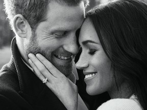 In this handout photo provided by Kensington Palace, Prince Harry and Meghan Markle pose for one of two official engagement photos at Frogmore House in December, 2017 in Windsor, United Kingdom. (Alexi Lubomirski via Getty Images)