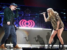 Ed Sheeran (L) and Taylor Swift perform onstage during 102.7 KIIS FM's Jingle Ball 2017 presented by Capital One at The Forum on December 1, 2017 in Inglewood, California. (Christopher Polk/Getty Images for iHeartMedia)