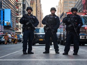 NEW YORK, NY - DECEMBER 11: New York City Police Department officers stand guard near the New York Port Authority Bus Terminal, December 11, 2017 in New York City. The Police Department said that one person, Akayed Ullah, was in custody for an attempted terror attack after an explosion in a passageway linking the Port Authority Bus Terminal with the subway. (Photo by Drew Angerer/Getty Images)