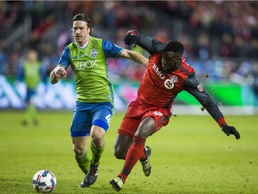 Toronto FC Jozy Altidore during 1st half MLS Cup final game action against Seattle Sounders Gustav Svensson at BMO Field in Toronto, Ont. on Saturday December 9, 2017.