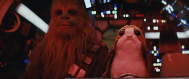 Star Wars: The Last Jedi..L to R: Chewbacca (Joonas Suotamo) and a Porg..Photo: Industrial Light & Magic/Lucasfilm..©2017 Lucasfilm Ltd. All Rights Reserved.