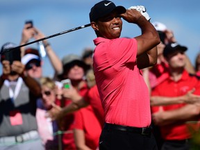 Tiger Woods tees off from the first hole during the final round of the Hero World Challenge golf tournament at Albany Golf Club in Nassau, Bahamas, on Dec. 3, 2017