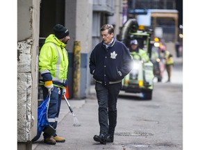 Toronto Mayor John Tory speaks with a city solid waste employee during a walk along O'Keefe Ln. by Yonge St. and Dundas St. E. in Toronto, Ont. on Saturday December 2, 2017. Mayor Tory launches clean sweep blitz for Yonge and Dundas neighbourhood. Ernest Doroszuk/Toronto Sun/Postmedia Network