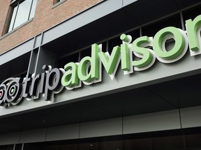 The company logo for the travel website TripAdvisor hangs at the company's headquarters, Thursday, Nov. 2, 2017, in Needham, Mass. (AP Photo/Steven Senne)