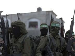 Hamas masked gunmen attend a rally against US decision to recognize Jerusalem as Israel's capital, in Beit Hanoun, northern Gaza Strip, Thursday, Dec. 7, 2017. A number of U.S. allies in the Middle East are condemning the Trump administration's decision with the United Arab Emirates, Kuwait, Qatar and Saudi Arabia urging Washington to reconsider and reverse the announcement.