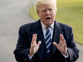 President Donald Trump speaks to members of the media before boarding Marine One at the White House, Saturday, Dec. 2, 2017, in Washington. Trump is traveling to New York for a fundraising event.