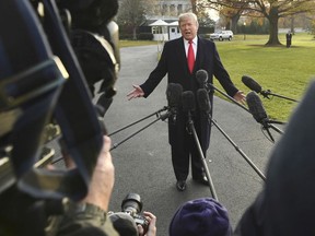 President Donald Trump speaks to reporters on the South Lawn of the White House in Washington, Monday, Dec. 4, 2017.