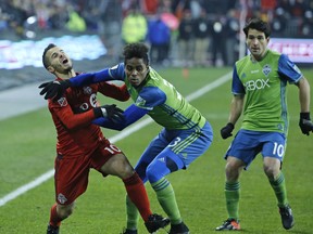 TFC's Sebastian Giovinco and Brad Evans as Toronto FC hosts Seattle Sounders for the MLS Cup at BMO Field in Toronto, Ont. on Saturday December 10, 2016. Michael Peake/Toronto Sun/Postmedia Network