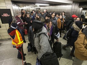 People are re-routed on a crowded TTC platform at Yonge and Bloor on January 12, 2017 because of incident on the tracks.