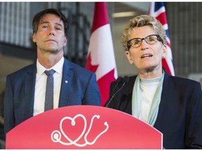 Health Minister  Eric Hoskins, Finance Minister  Charles Sousa and Premier Kathleen Wynne at Jenner Jean-Marie Community Recreation Centre for announcement Friday April 28, 2017. Craig Robertson/Toronto Sun/Postmedia Network