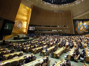 People gather at the General Assembly, prior to a vote, Thursday, Dec. 21, 2017, at United Nations headquarters.