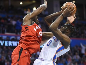 Oklahoma City Thunder's Jerami Grant tries to shoot over Toronto Raptors' Serge Ibaka on Dec. 27, 2017