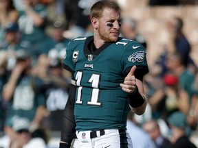 Quarterback Carson Wentz of the Philadelphia Eagles gives a thumbs up prior to the start of the game against the Los Angeles Rams on Dec. 10, 2017