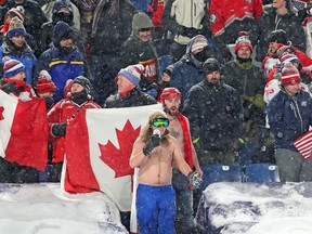 Fans from Canada cheer for their team during the IIHF World Junior Championship against the United States at New Era Field on December 29, 2017 in Buffalo, New York. The United States beat Canada 4-3.