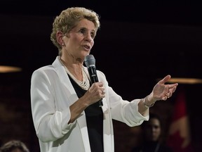 Premier Kathleen Wynne addresses questions from the public during a town hall meeting in Toronto on Monday, November 20, 2017. (THE CANADIAN PRESS/Christopher Katsarov)