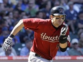 In this Sept. 2, 2009, file photo, Houston Astros' Aaron Boone hustles down the first base line during the eighth inning of a baseball game against the Chicago Cubs at Wrigley Field in Chicago.  (AP Photo/Charles Rex Arbogast)