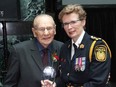 The late Johnny Bower is honoured alongside Peel Regional Police Chief Jennifer Evans.