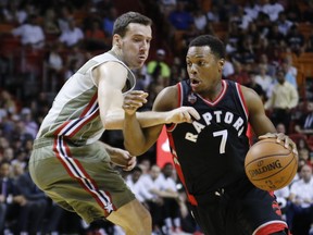 Toronto Raptors' Kyle Lowry drives past Miami Heat guard Goran Dragic. (AP FILES)