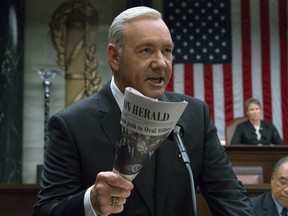 This image released by Netflix shows Kevin Spacey in a scene from "House Of Cards." Netflix says it's suspending production on "House of Cards" following harassment allegations against Spacey.  (David Giesbrecht/Netflix via AP) ORG XMIT: NYET205 ORG XMIT: POS1710311302034034