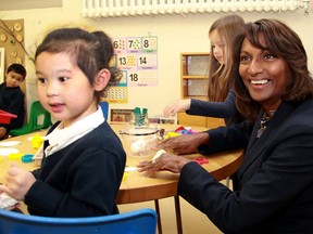 Liberal cabinet minister Indira Naidoo-Harris, the minister responsible for early years and child care visits with children at St. Thomas Aquinas Public School in Toronto. in an undated file photo.