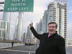 Mayor John Tory celebrates the opening of the Gardiner's York St. ramp. It has been closed nine months for a major construction project. (VERONICA HENRI, Toronto Sun)