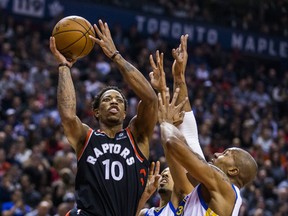 Toronto Raptors' DeMar DeRozan goes up for a shot against theGolden State Warriors on Saturday night. (Ernest Doroszuk/Toronto Sun)