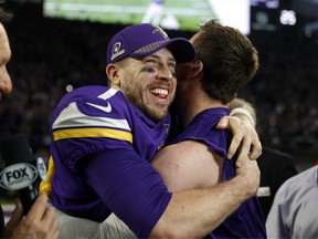 Minnesota Vikings quarterback Case Keenum (left) leads his team into Philadelphia on Sunday. (AP PHOTO)