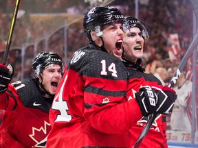 Canadian players celebrate a goal in the gold medal game against Sweden on Jan. 5, 2018