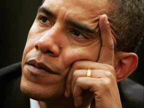 United States Senator Barack Obama (D-IL) listen to concerns from former employees and family members of two Illinois nuclear weapons plants prior to testifying on their behalf in front of the federal Advisory Board on Radiation and Worker Health December 12, 2006 in Naperville, Illinois. (Scott Olson/Getty Images)