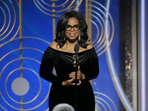 Oprah Winfrey accepts the Cecil B. DeMille Award at the 75th Annual Golden Globe Awards in Beverly Hills, Calif., on Sunday, Jan. 7, 2018. (Paul Drinkwater/NBC via AP)