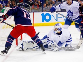 Leafs backacup goaltender  Curtis McElhinney stops a shot from Cam Atkinson  of the Columbus Blue Jackets earlier this season Getty Images