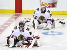 Jeff Glass (30) and Anton Forsberg of the Chicago Blackhawks warm up prior to the game against the New York Rangers at Madison Square Garden on Jan. 3. (Photo by Bruce Bennett/Getty Images)