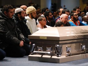 Mourners listen to paryers and speeches during the funeral services for three of the victims of the deadly shooting at the Quebec Islamic Cultural Centre, at the Congress Centre in Quebec City, Quebec, February 3, 2017.