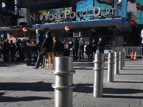 New York Mayor Bill de Blasio (C) makes an announcement during a press conference in Times Square on January 2, 2018 about new barriers to prevent terror attacks and safeguard sidewalks and plazas from vehicles.