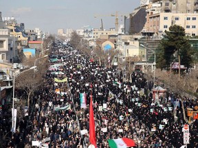 Iranian pro-government supporters march during a rally in support of the regime after authorities declared the end of deadly unrest, in the city of Mashhad on January 4, 2018. A total of 21 people died and hundreds were arrested in five days of unrest that began on December 28 as protests against economic grievances and quickly turned against the regime as a whole, with attacks on government buildings and police stations.
