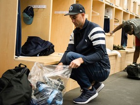 Toronto Argonauts quarterback Ricky Ray cleans out his locker at the practice facility in Toronto on Nov. 29, 2017